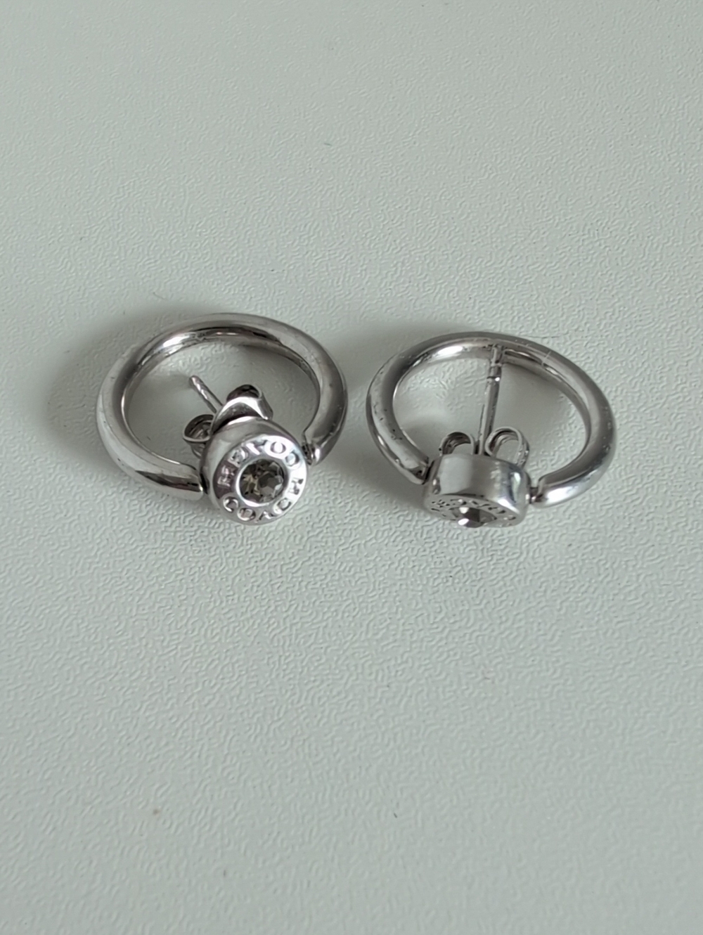 Coach Silver Tone Hoop Earrings with Crystal Centers